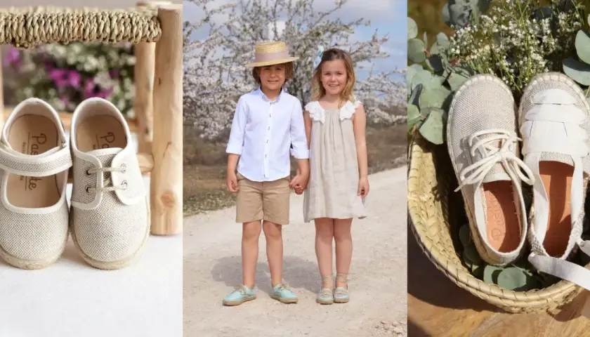 Un niño y una niña, como pajes, lucen calzado de esparto. Zapatos de tela y esparto en cestas y sobre un taburete.