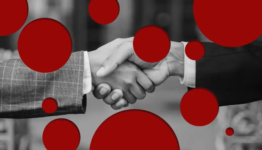 Apretón de manos entre dos personas, con círculos rojos superpuestos. Son señales de que si te van a contratar.